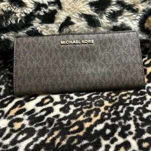 Brown and dark brown, Michael Kors wallet inside of the wallet red